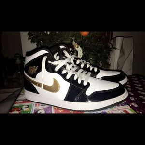 Size 9.5 women’s air Jordan patent black gold